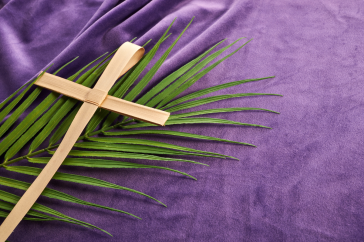 palm and cross on purple background