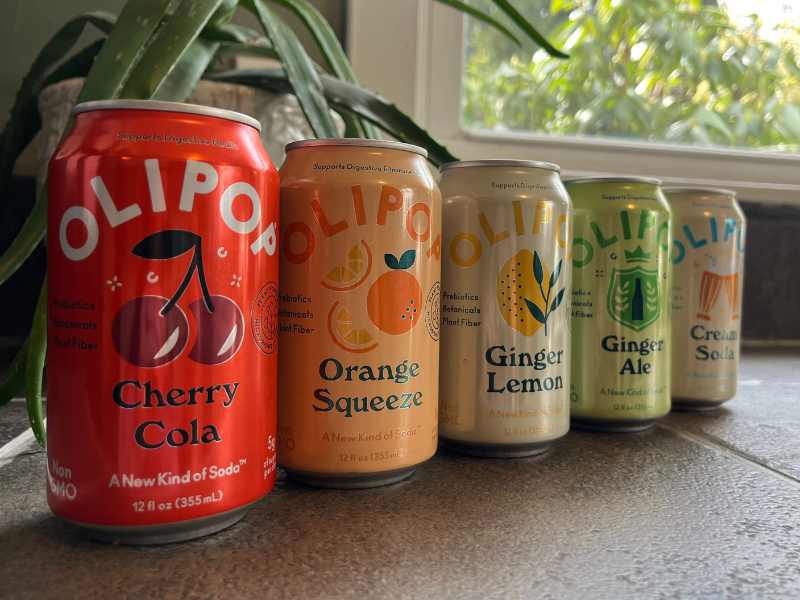 5 different flavors of Olipop cans